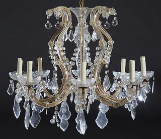Eight Light Louis XV Style Glass and Crystal Chandelier, 20th c., the scrolling arms around a central cut glass support, hung with glass florets and p