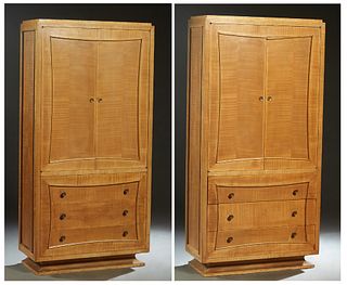 Pair of French Carved Maple Art Deco Wardrobes, 20th c., the stepped top over double doors above a bank of three drawers, on a plinth base, H.- 67 in.