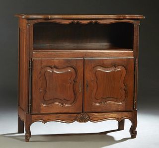 French Louis XV Style Carved Oak Sideboard, 20th c., the stepped parquetry inlaid serpentine top over open storage above two fielded panel cupboard do