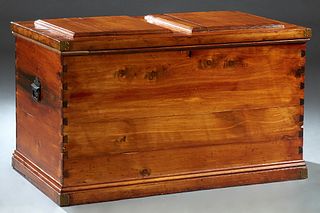 Large Cedar Bedding Box, 19th c., the stepped top with brass corners, over dovetailed sides with folding iron handles,on a stepped plinth base, H.- 28
