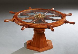 Unusual Carved Mahogany Ship's Wheel Coffee Table, 20th c., the circular glass topped wheel mounted on a tapered hexagonal base, H.- 19 1/4 in., Dia.-