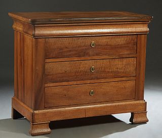 French Louis Philippe Carved Walnut Commode, 19th c., the rounded corner top over a cavetto frieze drawer above three lower drawers, on a plinth base 