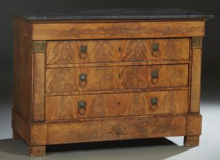 French Empire Ormolu Mounted Carved Mahogany Marble Top Commode, 19th c., the figured black marble over a frieze drawer above three deep drawers flank
