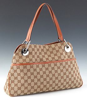 Gucci Eclipse Tote Bag, in beige and brown monogram canvas with brown leather straps and silver hardware, the magnetic clasp opening to a light brown 