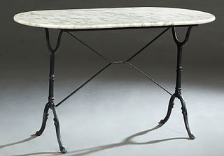 French Parisian Marble Top and Iron Bistro Table, 20th c., the figured oval marble on an iron trestle base joined by an X-form stretcher, H.- 28 in., 