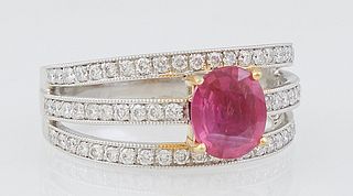 Lady's Platinum Dinner Ring, with an oval 1.05 ct. ruby atop triple split bands mounted with small round diamonds, total diamond wt.- .53 cts., Size 6