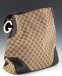 Gucci Charlotte Medium Hobo Bag, in beige monogram canvas with dark brown leather accents gold hardware, opening to a dark brown canvas lined interior