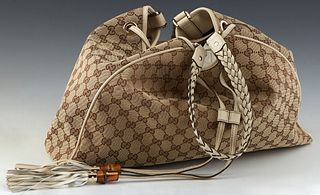 Gucci Peggy Tote, in beige monogrammed canvas with ivory braided leather accents and gold hardware, opening to a brown canvas lined interior with side