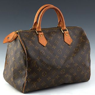 Louis Vuitton Speedy 30 Handbag, in brown monogram coated canvas with vachetta leather accents and golden brass hardware, opening to a brown canvas li
