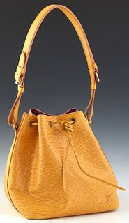 Louis Vuitton Noe PM Bucket Bag, in yellow epi leather with golden brass hardware, the interior of the bag lined in purple suede, H.- 10 3/4 in., W.- 