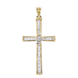 An 18ct gold diamond cross pendant. The brilliant-cut diamond, to the brilliant-cut diamond channel-