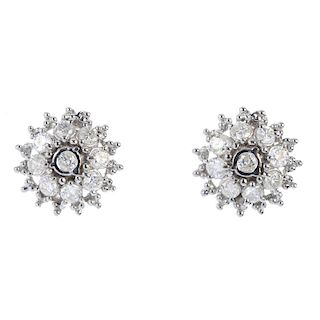 A pair of 14ct gold diamond cluster earrings. Each designed as a brilliant-cut diamond collet, withi