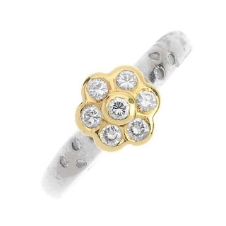 An 18ct gold diamond floral cluster ring. The brilliant-cut diamond collet, within a similarly-cut d