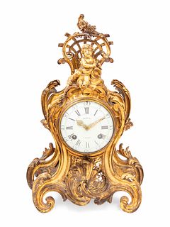 A Louis XV Gilt Bronze Clock and Stand