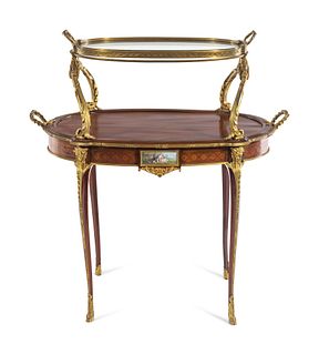 A Louis XV Style Gilt Bronze and Porcelain Mounted Two-Tier Serving Table