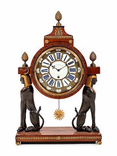 A French Egyptian Revival Gilt Bronze Mounted Mahogany Clock