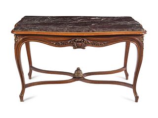 An Italian Louis XV Style Carved Walnut Marble-Inset Serpentine-Top Center Table