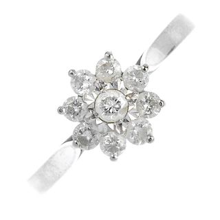 (57565) An 18ct gold diamond cluster ring. Of floral design, the brilliant-cut diamond cluster to th