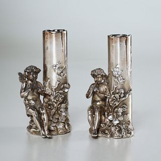 Pair sterling deposit porcelain cherub bud vases