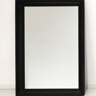 Contemporary designer ebonized wall mirror