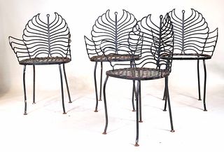 Four Green-Painted Cast Iron Garden Chairs