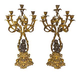 * A Pair of Louis XV Style Gilt and Patinated Bronze Seven-Light Candelabra, Height 25 1/2 inches.