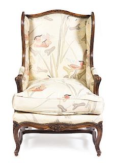 A Louis XV Style Bergere a Oreilles, 20TH CENTURY, Height 43 1/2 inches.
