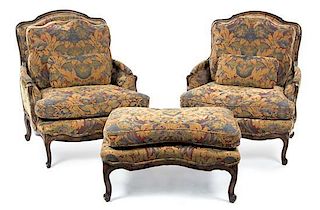 A Pair of Louis XV Style Walnut Bergeres, Height of chair 38 inches.