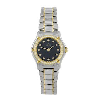 EBEL - a lady's 1911 bracelet watch. Stainless steel case with factory diamond set yellow gold bezel