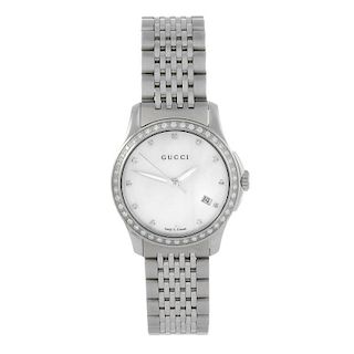 GUCCI - a lady's 126.5 bracelet watch. Stainless steel case with factory diamond set bezel. Numbered