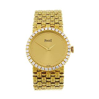 PIAGET - a lady's bracelet watch. 18ct yellow gold case with factory diamond set bezel. Reference 97