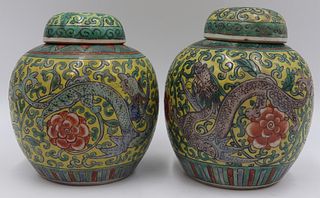 Pair of Chinese Enamel Decorated Lidded Urns.