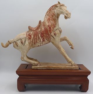 Tang Style Horse on a Hardwood Stand.