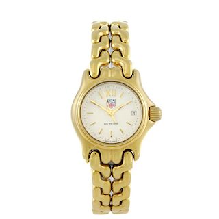 TAG HEUER - a lady's bracelet watch. Gold plated case with stainless steel case back. Numbered S04.7