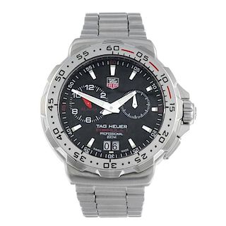 TAG HEUER - a gentleman's Formula 1 Alarm bracelet watch. Stainless steel case with calibrated bezel