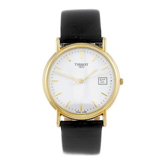 TISSOT - a gentleman's wrist watch. 18ct yellow gold case. Numbered G667330. Unsigned quartz movemen