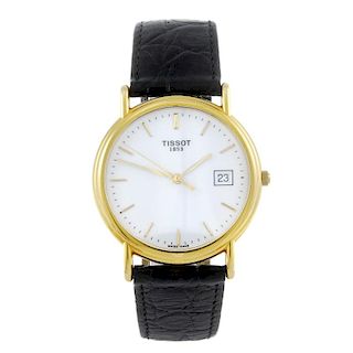 TISSOT - a gentleman's wrist watch. 18ct yellow gold case. Numbered G 667.330. Unsigned quartz movem