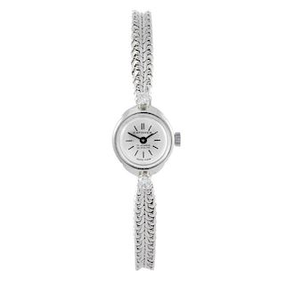 CATOREX - a lady's bracelet watch. White metal case, stamped 18k, 0.750. Unsigned manual wind moveme