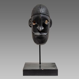 Oceanic Wooden Mask with inlaid eyes.