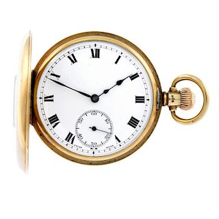 A half hunter pocket watch. 9ct gold case with presentation engraving to the case back, hallmarked B