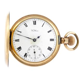 A half hunter pocket watch by Waltham. Gold plated case. Numbered 257145. Signed keyless wind sevent