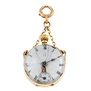 An open face fob watch. Yellow metal case with exhibition case back. Unsigned keyless wind movement.