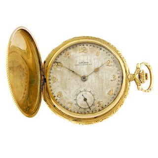 A full hunter pocket watch by Vulcain. Yellow metal case, stamped 18C, with crown to cover. Number 7
