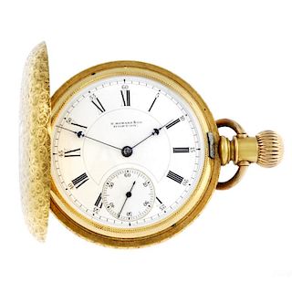 A full hunter pocket watch by E.Howard & Co, Boston. Yellow metal case with ornate engraving and ini
