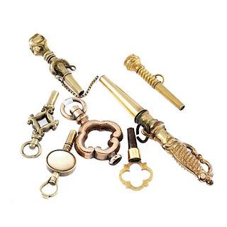 A small group of seven yellow metal pocket watch keys. One in the shape of a sword. 12gms. <br><br>