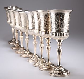 A SET OF EIGHT SILVER-PLATED GOBLETS, each campana bowl par
