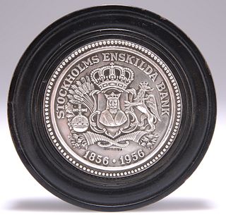 A BANK OF SWEDEN SILVER PAPERWEIGHT, by Sporrong & Co, in a
