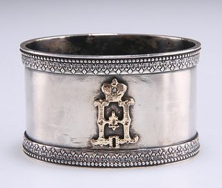 A RUSSIAN SILVER NAPKIN RING, oval, gold mounted with initi