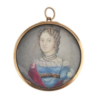 A mid 19th century gold miniature portrait pendant. The circular-shape panel, depicting an elegant l