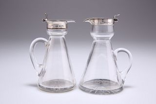 TWO GEORGE V SILVER-MOUNTED GLASS WHISKY TOTS, the first by
